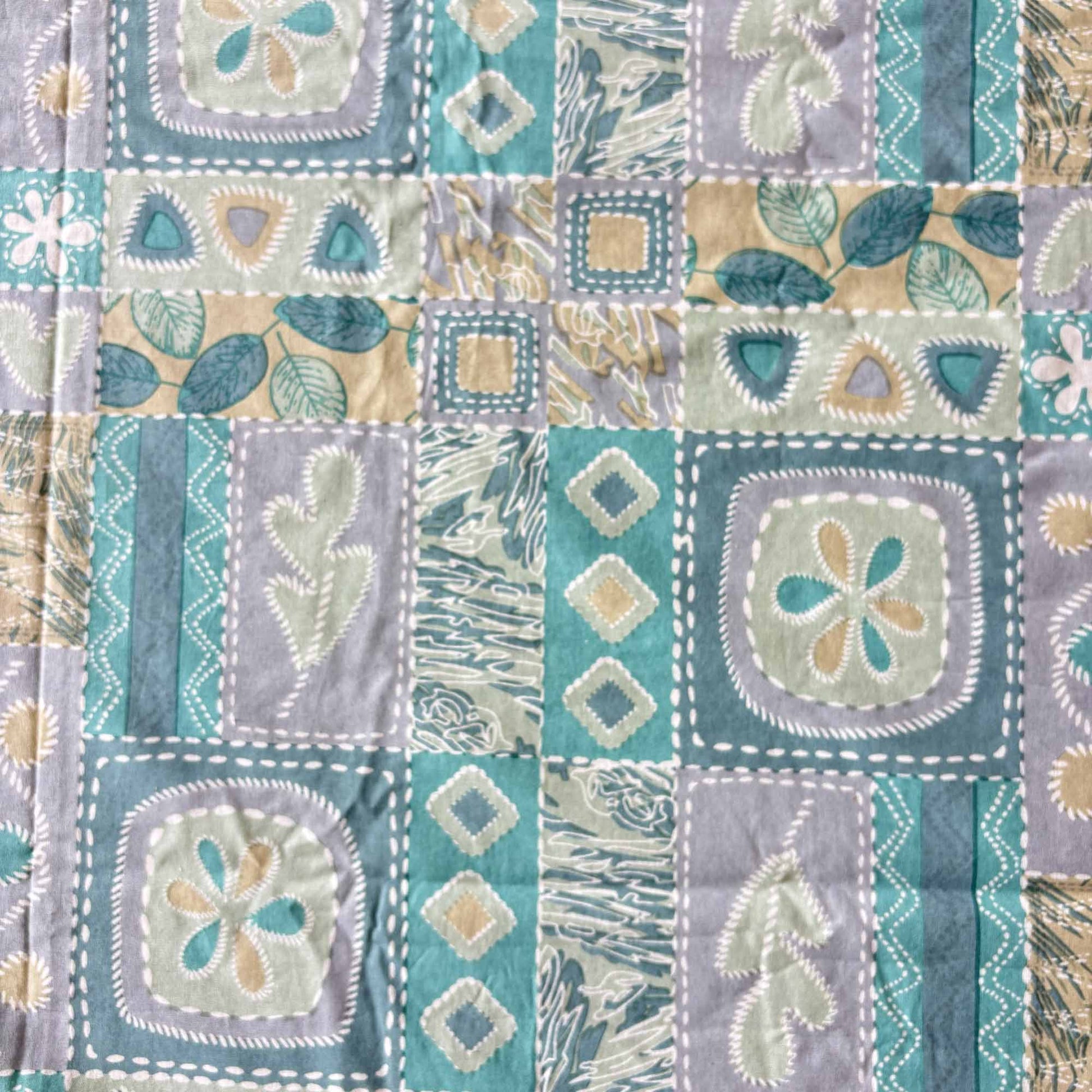 Cotton bedsheets online with artistic patchwork quilt pattern